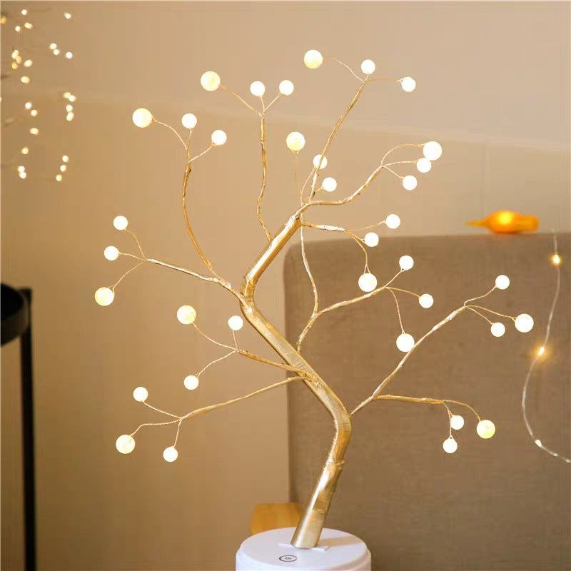 Decorative LED branch with lights on a beige background