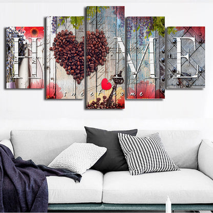 Five-piece wall art set with coffee beans heart design on a white sofa.