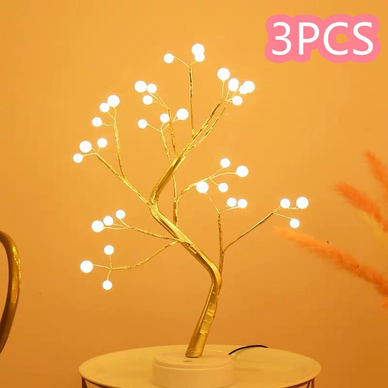 Decorative LED branch light on a stand with '3PCS' text in pink on an orange background